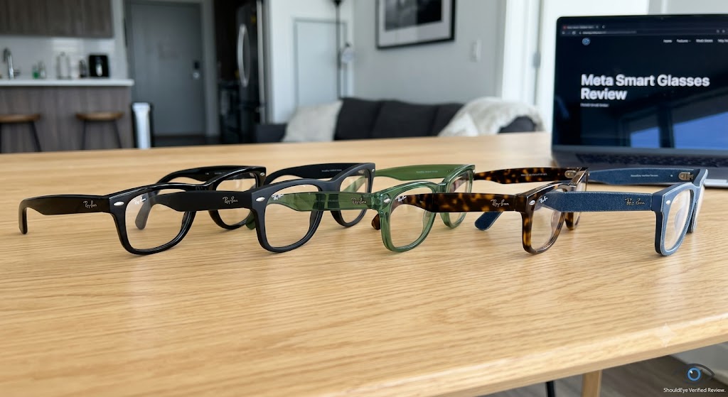 Four pairs of Ray-Ban Meta Gen 2 smart glasses in different colors lined up on a wooden table.