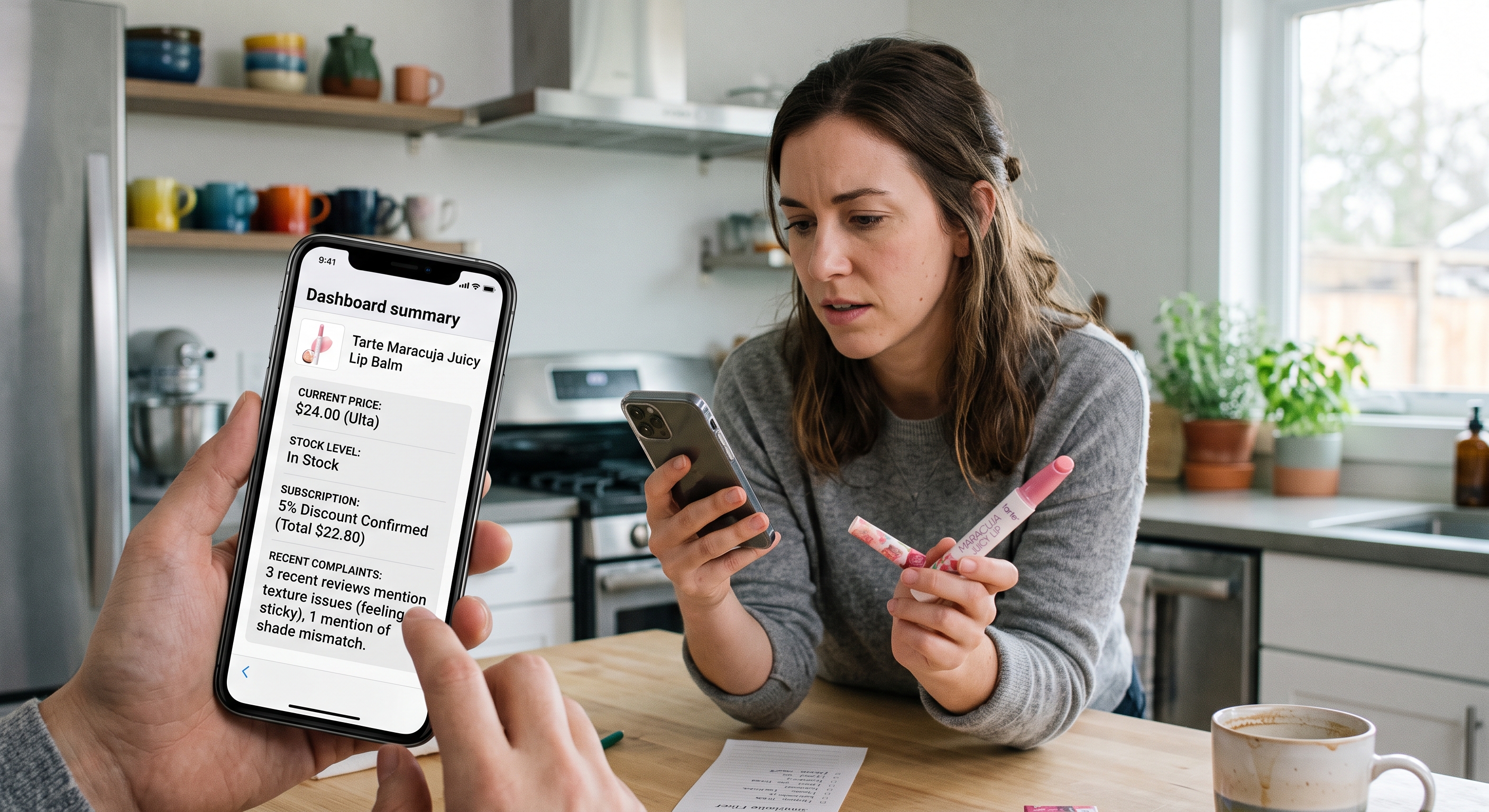 A phone screen displaying lip balm pricing and stock data while a woman reviews product feedback at a kitchen table.