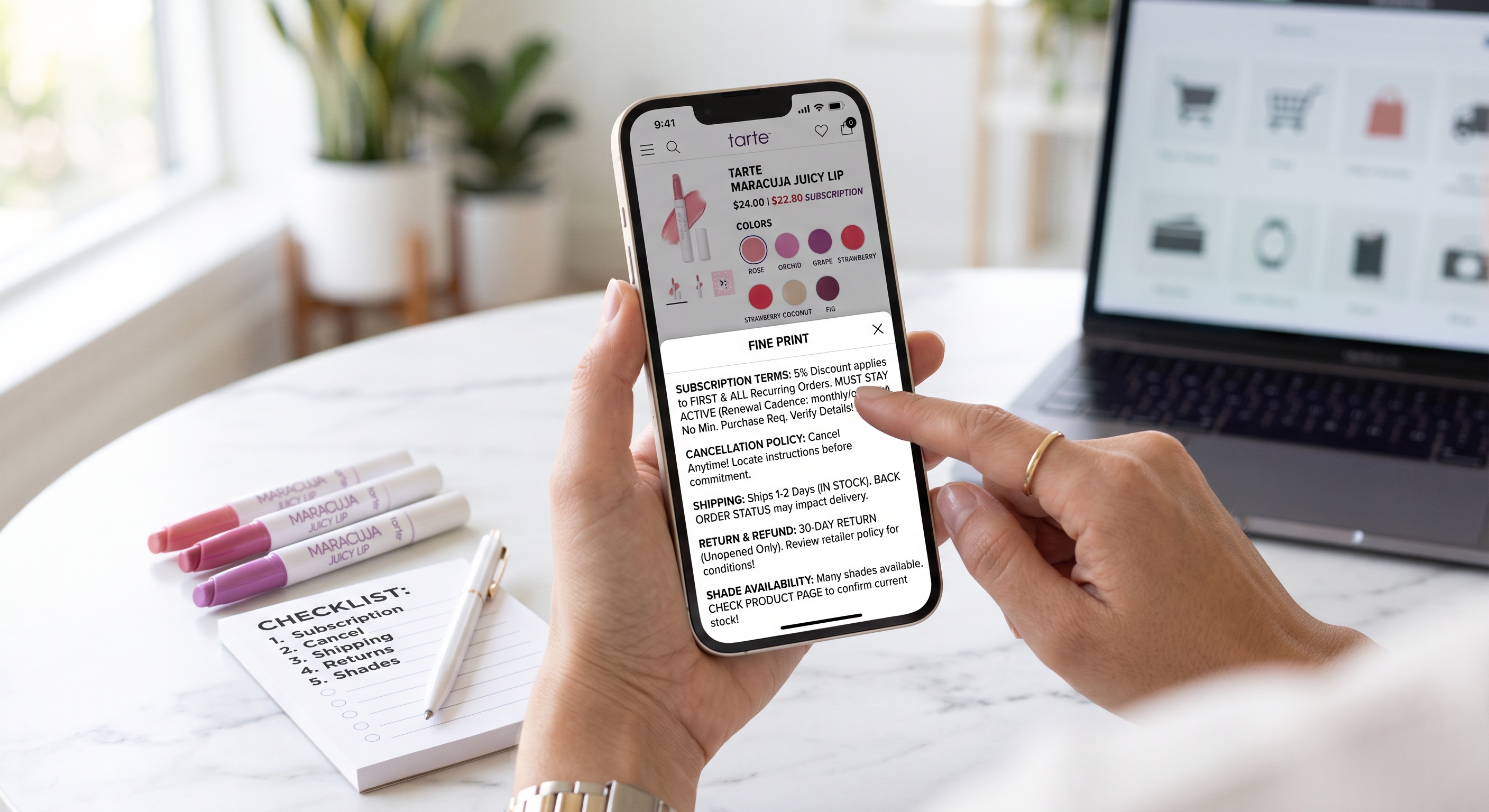 A hands-on view of a smartphone displaying lip balm subscription fine print next to a notepad and lip products.