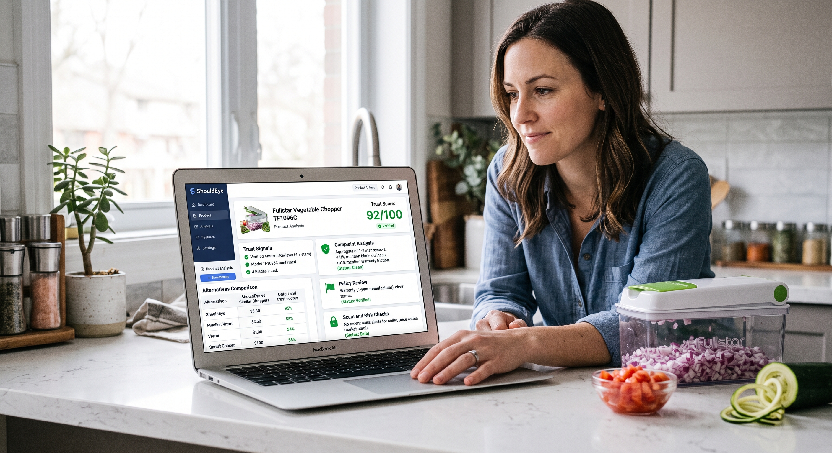 A woman views a ShouldEye product trust score analysis for a Fullstar chopper on her laptop in a kitchen setting.
