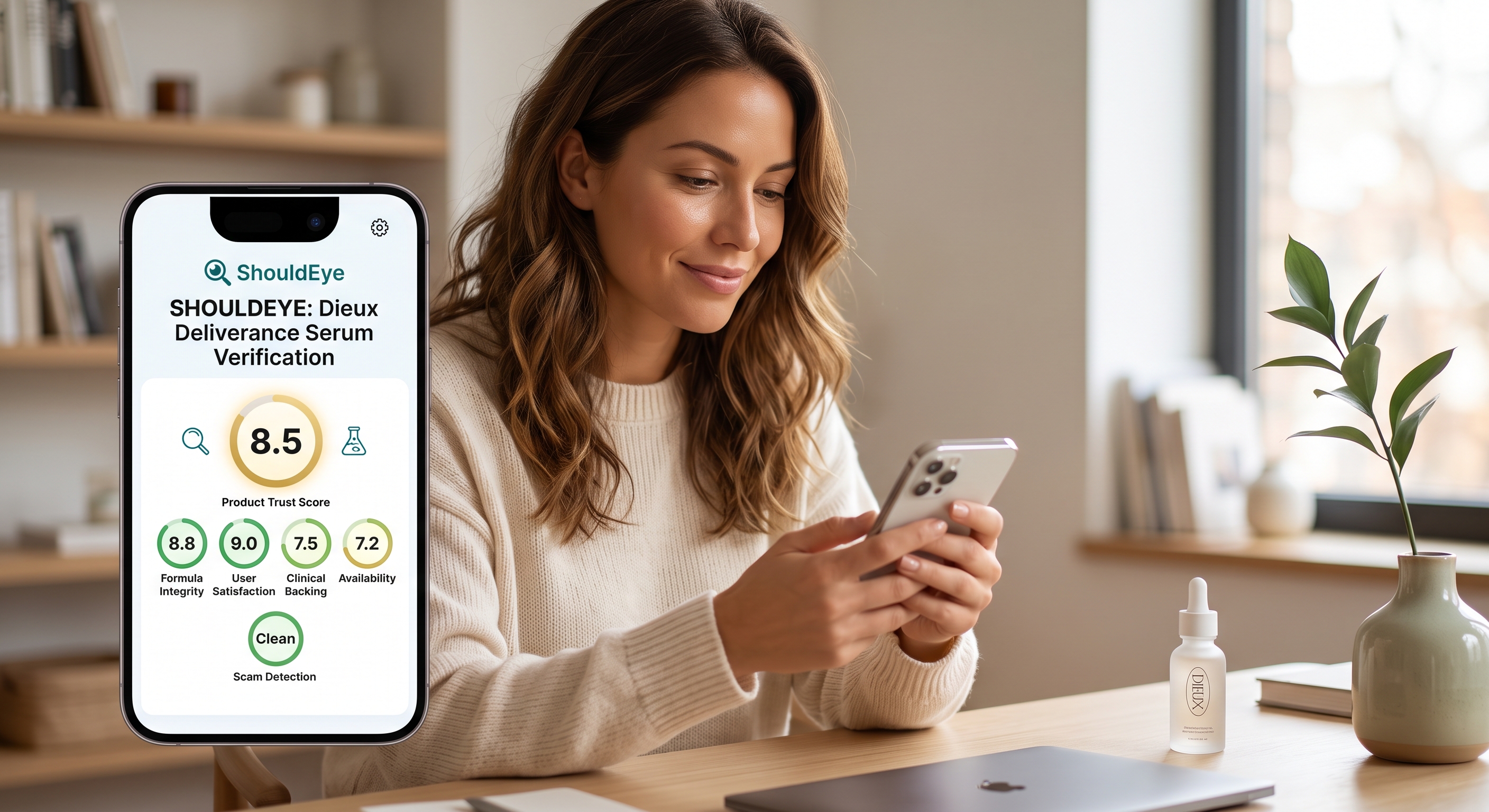 A woman smiles while using her phone to check Dieux Deliverance Serum scores on the ShouldEye app at a desk.